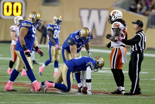 Winnipeg Blue Bombers' quarterback Drew Willy (5) on the field after being sacked by the BC Lions' during first half CFL football in Winnipeg, Saturday, October 25, 2014. (TREVOR HAGAN/WINNIPEG FREE PRESS)