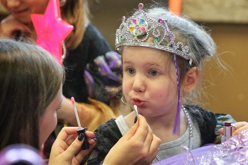 Bailee Shur, 3, has lipgloss applied during the Princess for a Day fundraising event at the ÄúcastleÄù at the Canadian Mennonite University. Around sixty little girls including five who are battling life-threatening illnesses are taking part in a unique fundraising event for the ChildrenÄôs Wish Foundation Äì Manitoba and Nunavut.  141026 October 26, 2014 Mike Deal / Winnipeg Free Press