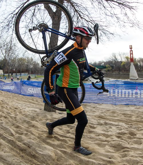 Sam Nayet from St. Pierre-Jolys, MB and team Offroad Syndicate runs through the grueling sand pit portion of the cycle-cross event being held at The Forks Sunday. 141026 - Sunday, October 26, 2014 -  (MIKE DEAL / WINNIPEG FREE PRESS)