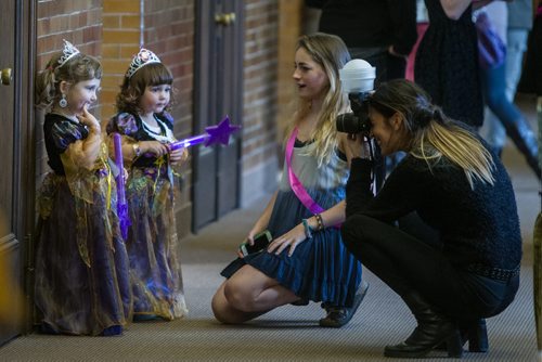 Chloe Streilein (left), 3, and Emrie Jochems, 2, get their photo taken by Christina Summers during the Princess for a Day fundraising event at the ÄúcastleÄù at the Canadian Mennonite University. Around sixty little girls including five who are battling life-threatening illnesses are taking part in a unique fundraising event for the ChildrenÄôs Wish Foundation Äì Manitoba and Nunavut.  141026 - Sunday, October 26, 2014 -  (MIKE DEAL / WINNIPEG FREE PRESS)