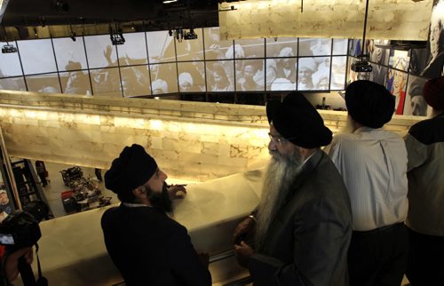 At left, Pardeep Singh Nagra, director of the Mississauga-based Sikh Heritage Museum of Canada and Harban Singh Brar of Winnipeg by the digital canvas in the Canadian Journeys gallery in The Canadian Museum for Human Rights that documents the tragic Komagata Maru incident. Pardeep  was in Winnipeg for the "Lions of the Sea" exhibit that explores the Komagata Maru incident on the 100th anniversary, this travelling exhibit at the Canadian Museum for Human Rights is on display Monday only. Pardeep overcame barriers of discrimination in the boxing ring, in the lead-up to the Sydney 2000 Olympics, Nagra launched a successfully legal challenge after being barred from fighting at the national championships because he refused to shave his beard.Kevin Rollason story  Wayne Glowacki/Winnipeg Free Press Oct.27  2014