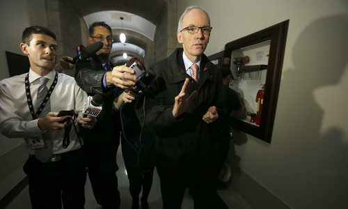 Greg Selinger Watch at MB. Legislature  , media chases  Minister Steve Ashton down the halls of the legislature Bldg as he was on his way to lunch , he maintains an optimistic view going forward no matter what happens.  Oct. 28 2014 / KEN GIGLIOTTI / WINNIPEG FREE PRESS