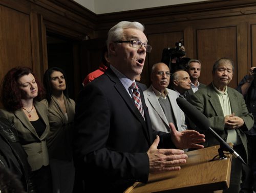 Premier Greg Selinger with his MLAs at the news conference Tuesday afternoon in the Manitoba Legislative building.  Larry Kusch/ Bruce Owen stories. Wayne Glowacki/Winnipeg Free Press Oct.28   2014 Bruce Owenstory. Wayne Glowacki/Winnipeg Free Press Oct.28   2014