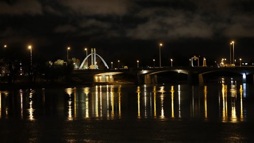 Norwood Bridge River's  23mx23m  Arch by artist  Catherine Widgery  symbol of Beautiful Winnipeg  before sunrise with light reflected on the Red River  in darks and light . weather today cloudy with a high of 5.  Oct. 29 2014 / KEN GIGLIOTTI / WINNIPEG FREE PRESS