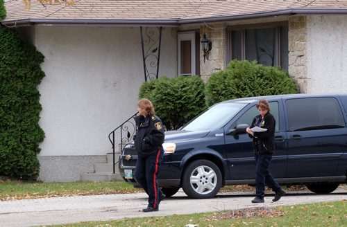 Winnipeg police are now searching the house and garage of Andrea Giesbrecht's home in the Maples. A large van with the WPS's Identification Unit, or forensics team, is backed up to the garage of the home. Another van is parked in front, and there are about six police vehicles on the street as well. 141029 - Wednesday, October 29, 2014 -  MIKE DEAL / WINNIPEG FREE PRESS