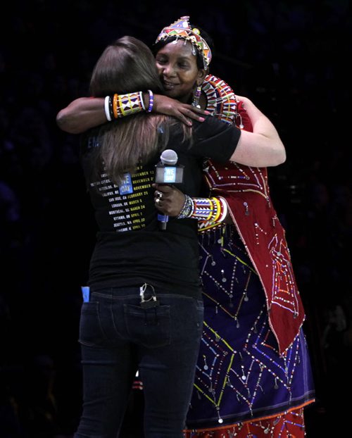 At right, Mama Leah Lato Toyianka, Kenyan Me to We Artisans mobilizer embraces Robin Wiszowaty ,Me to We motivational speaker at  the WE Day event in the MTS Centre Wednesday. Nick Martin  story. Wayne Glowacki/Winnipeg Free Press Oct.29   2014