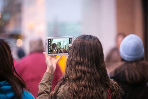 Waywayseecappo student takes a picture on the way to MTS Centre for We Day. Waywayseecappo at We Day Manitoba 2014.  141029 - Wednesday, October 29, 2014 - (Melissa Tait / Winnipeg Free Press)