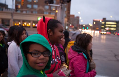 Kassidy Bone (foreground) and Deevah Clearsky laugh as they walk along Portage Avenue on their way to MTS Centre for We Day. Waywayseecappo at We Day Manitoba 2014.  141029 - Wednesday, October 29, 2014 - (Melissa Tait / Winnipeg Free Press)
