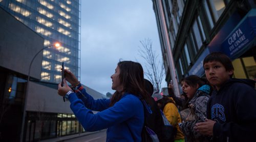 Kristine Swain laughs while taking a photo on the way to MTS Centre the morning of We Day. Waywayseecappo at We Day Manitoba 2014.  141029 - Wednesday, October 29, 2014 - (Melissa Tait / Winnipeg Free Press)