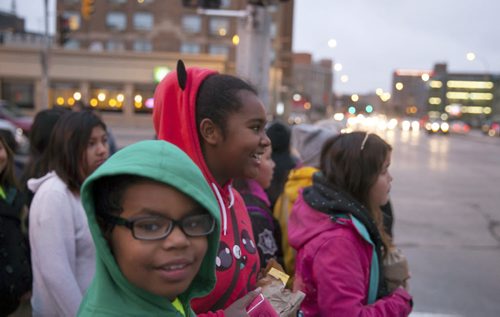 Kassidy Bone (foreground) and Deevah Clearsky laugh as they walk along Portage Avenue on their way to MTS Centre for We Day. Waywayseecappo at We Day Manitoba 2014.  141029 - Wednesday, October 29, 2014 - (Melissa Tait / Winnipeg Free Press)