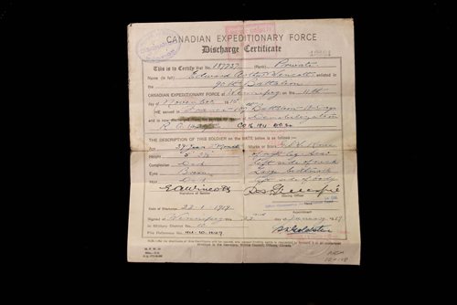 49.8 World War 1 / Remembrance Day Feature  Photo's of artifacts from the Legion House Museum at 134 Marion Street.  Edward Arthur Wincott Discharge paper 39 years old when enlisted in the 90th battalion, then served in the 107th battalion. First custodian of Norwood St. Boniface Branch.    Oct 29,  2014 Ruth Bonneville / Winnipeg Free Press