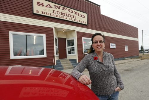 WHEN & WHERE: Sandford Lumber & Building Supplies in Sanford, Owner Andrea Morann, for a story about some of the quirky places in rural Manitoba that are licensed to sell liquor, by Manitoba. Sandford Lumber also has a liquor section.Also shot Morann  outside under the Sanford Lumber sign. Bill Redekop story Oct. 30 2014 / KEN GIGLIOTTI / WINNIPEG FREE PRESS