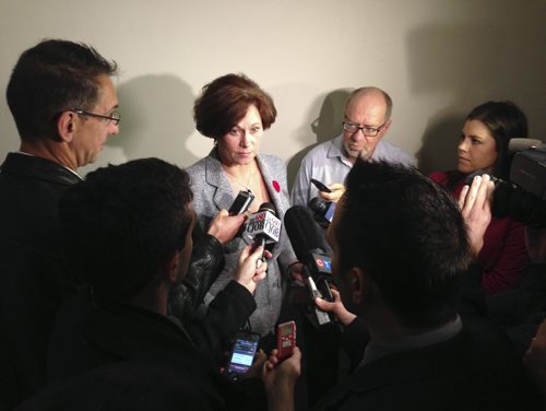 Minister Theresa Oswald speaks with media at the Manitoba Legislative Building Thursday, October 30, 2014. Bruce Owen / Winnipeg Free Press