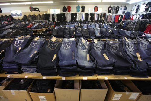 Long piles of high-end jeans line the Sargent Blue Jean store located at 1136 Sargent Ave.  David Sanders feature story.   Oct 30,  2014 Ruth Bonneville / Winnipeg Free Press