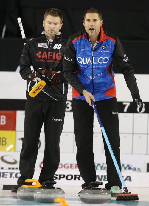 Winnipeg curler Mike McEwen (left) takes on CalgaryÄôs John Morris (right) during action at The Masters Grand Slam of Curling at the Selkirk Recreational Complex  on Fri., Oct. 31, 2014. Photo by Jason Halstead/Winnipeg Free Press