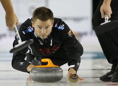 Winnipeg curler Mike McEwen shoots during action against CalgaryÄôs John Morris at The Masters Grand Slam of Curling at the Selkirk Recreational Complex  on Fri., Oct. 31, 2014. Photo by Jason Halstead/Winnipeg Free Press