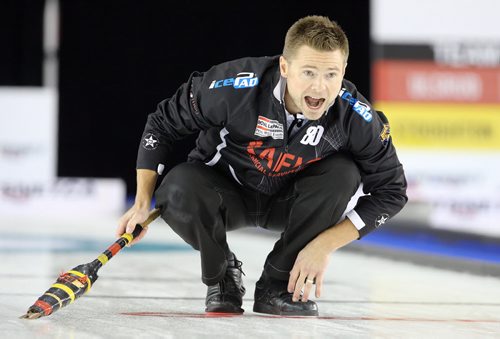 Winnipeg curler Mike McEwen calls on his sweepers during action against CalgaryÄôs John Morris at The Masters Grand Slam of Curling at the Selkirk Recreational Complex  on Fri., Oct. 31, 2014. Photo by Jason Halstead/Winnipeg Free Press