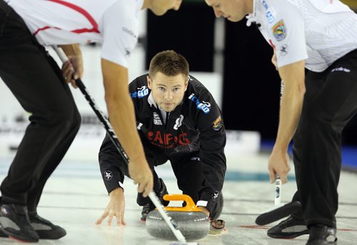 Winnipeg curler Mike McEwen shoots during action against CalgaryÄôs John Morris at The Masters Grand Slam of Curling at the Selkirk Recreational Complex  on Fri., Oct. 31, 2014. Photo by Jason Halstead/Winnipeg Free Press