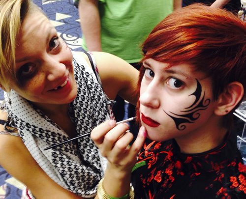 Kira Peveira, gets tribal makeup applied by artist Kristin Johnson with Cartizan face painting¤at the Central Canada Comic Con event at the RBC Convention Centre Saturday. Nov 1/2014   Ruth Bonneville / Winnipeg Free Press¤