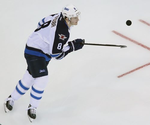 Winnipeg Jets' Jacob Trouba (8) juggling a puck during warmup prior to the teams game against the New York Rangers' at Madison Square Garden in New York City, Saturday, November 1, 2014. (TREVOR HAGAN/WINNIPEG FREE PRESS)