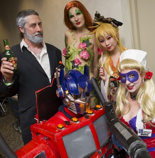 141101 Winnipeg - DAVID LIPNOWSKI / WINNIPEG FREE PRESS Christopher Hawkins dressed as The Most Interesting Man in the World, Frances Matlock dressed as Poison Ivy, Christina Xue dressed as Kagamine Len, Nicole Ducharme dressed as Harlequin, and Tony Liarakos dressed as Optimus Prime all participated in the costume contest at C4 Central Canada Comic Con Saturday November 1, 2014 at RBC Convention Centre.
