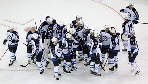 The Winnipeg Jets' celebrate after defeating the New York Rangers' in a shootout during NHL hockey at Madison Square Garden in New York City, Saturday, November 1, 2014. (TREVOR HAGAN/WINNIPEG FREE PRESS)
