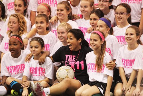 Canadian Olympic bronze medallist Desiree Scott poses for group photos after working out with girls aged 9-18 at the First Annual Desiree Scott KidSport Winnipeg Soccer Camp at the Seven Oaks Soccer Complex. 141102 November 02, 2014 Mike Deal / Winnipeg Free Press