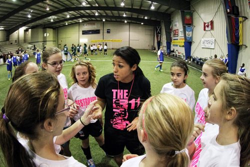 Canadian Olympic bronze medallist Desiree Scott gives a little pep-talk just before a scrimmage game with girls aged 9-18 at the First Annual Desiree Scott KidSport Winnipeg Soccer Camp at the Seven Oaks Soccer Complex. 141102 November 02, 2014 Mike Deal / Winnipeg Free Press