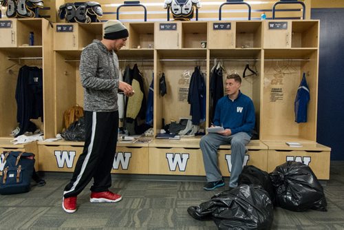 Members of the Winnipeg Blue Bombers clean out their lockers at the end of the season Sunday afternoon. Robert Marve (16) (left) and Drew Willy (5) (right) talk as they clean out their lockers. 141102 - Sunday, November 02, 2014 -  (MIKE DEAL / WINNIPEG FREE PRESS)