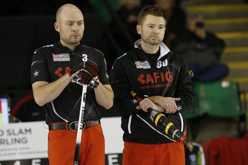 November 2, 2014 - 141102  -  Mike McEwen (R) and BJ Neufeld look on as  Brian Gushew sets up a shot during his championship game in the Masters Grand Slam of Curling against Gushew in Selkirk, Sunday, November 2, 2014. John Woods / Winnipeg Free Press