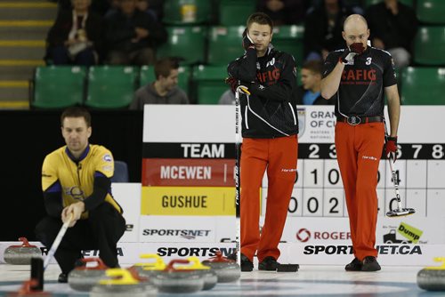 November 2, 2014 - 141102  -  Mike McEwen (L) and BJ Neufeld look on as  Brian Gushew sets up a shot during his championship game in the Masters Grand Slam of Curling against Gushew in Selkirk, Sunday, November 2, 2014. John Woods / Winnipeg Free Press