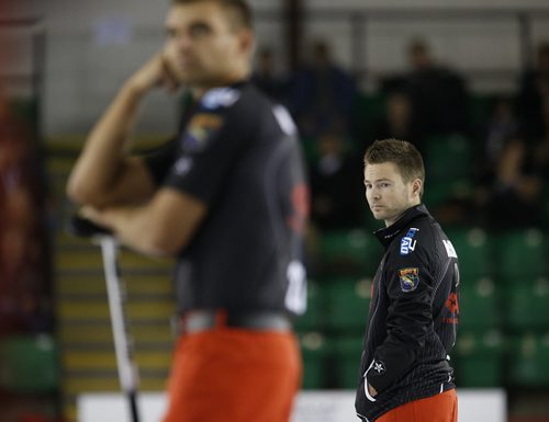 November 2, 2014 - 141102  -  Mike McEwen looks at the house as his second Matt Wozniak looks on during his championship game in the Masters Grand Slam of Curling against Brian Gushew in Selkirk, Sunday, November 2, 2014. John Woods / Winnipeg Free Press