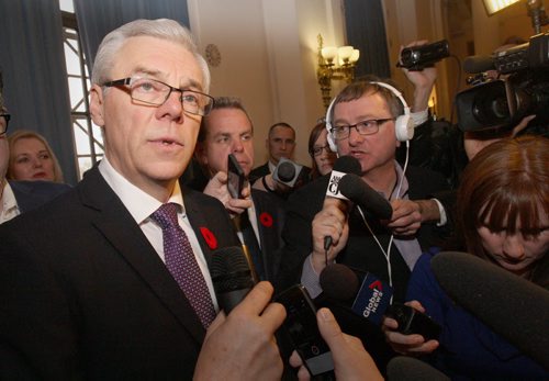 After a turbulent day with 5 senior ministers resigning from cabinet Premier Greg Selinger talks with media after a ceremony where 5 new cabinet ministers were sworn in at the Manitoba Legislature Monday afternoon  - See Martin Cash story - Oct 24, 2014   (JOE BRYKSA / WINNIPEG FREE PRESS)