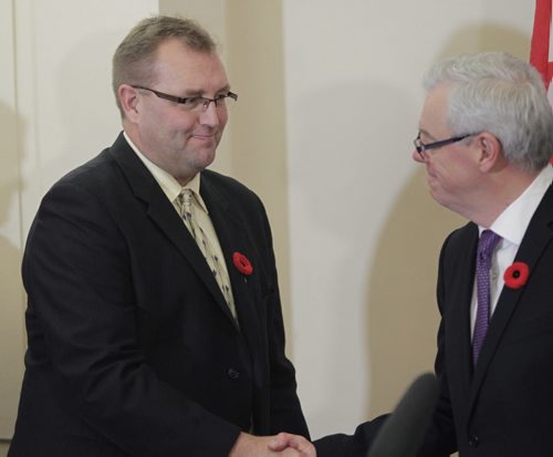 At right,  Manitoba Premier Greg Selinger with Peter Bjornson,  Minister of Education and Advanced Learning  at the swearing-in ceremony for the changes in cabinet Tuesday. Bruce Owen/Larry Kusch story.   WAYNE GLOWACKI / WINNIPEG FREE PRESS) Nov.3 2014