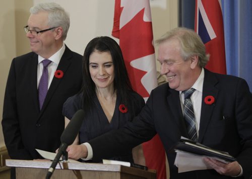 In centre, Deanne Crothers becomes the  Minister of Healthy Living and Seniors at the swearing-in ceremony for the changes in cabinet Tuesday. Bruce Owen/Larry Kusch story.   WAYNE GLOWACKI / WINNIPEG FREE PRESS) Nov.3 2014