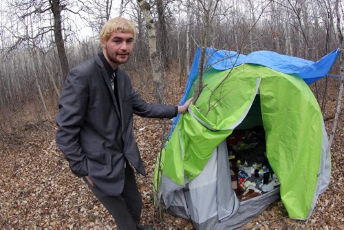 20 year old Austin Saunders lives in a tent in the forest where the Brenda Leipsic dog park is. Gord Sinclair yarn. BORIS MINKEVICH / WINNIPEG FREE PRESS November 3, 2014