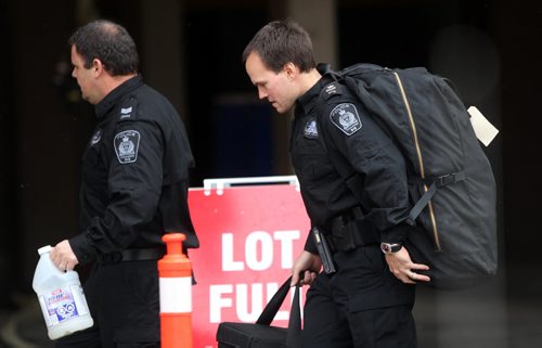 Winnipeg Police Bomb Unit takes a robot inside the Delta Hotel in downtown Winnipeg to access the risk of a device found in the underground parkade of the St Marys hotel  - Staff discovered the device at 7AM this morning and is said to be six inches long wrapped in electrical tape with wires- See Adam Wazny story - Oct 24, 2014   (JOE BRYKSA / WINNIPEG FREE PRESS)