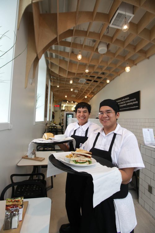 Sheldon (front) and his twin brother Eldon Lachose pose for a photo at the front of the new Lunch Bell Restaurant that they have been working and training at for a number of weeks. The restaurant located in the Bell Hotel on Main street which opened recently is a upscale lunch bar   sponsored by an organization called Change, a non-profit  which helps Äúpeople who need supportÄù  due to mental or social challenges, train and work in the restaurant industry.    Nov 4,  2014 Ruth Bonneville / Winnipeg Free Press