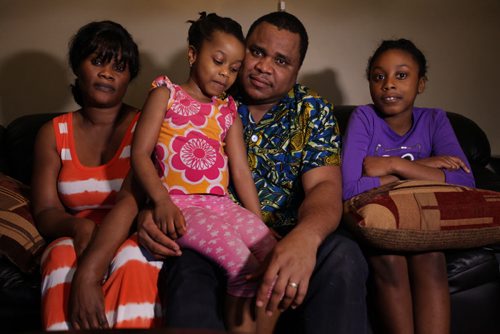 Alie Nasralla wants to visit his extended family over Christmas in Sierra  Leone but is concerned about quarantine requirements on his return home.  He sits with his family, Katherine (wife), Alrina (older girl) and Linda (youngest) in their home in Fort Rouge. See Carol Sanders story.  Nov 5,  2014 Ruth Bonneville / Winnipeg Free Press