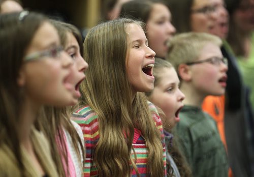 Members of the  Winnipeg Youth Chorus give it their all as they rehearse for the last time at Miles Macdonell Collegiate before heading off to New York City to perform at Alice Tully Hall in Lincoln Center during the US's Veteran's Day weekend to sing a Holocaust Oratorio  written by Winnipeg composer Zane Zalis.  Standup photo Nov 5,  2014 Ruth Bonneville / Winnipeg Free Press