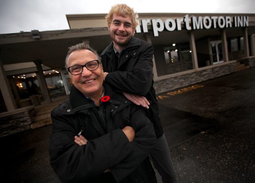 20-year-old Austin Saunders and Pat Werestiuk, the 60-year-old who found him pose in front of his temproary quarters at the Airport Motor Inn on Ellice ave. See Sinclair Story. November 7, 2014 - (Phil Hossack / Winnipeg Free Press)