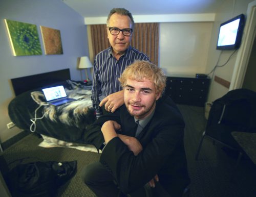20-year-old Austin Saunders and Pat Werestiuk, the 60-year-old who found him pose in his temproary quarters a room at the Airport Motor Inn on Ellice ave. See Sinclair Story. November 7, 2014 - (Phil Hossack / Winnipeg Free Press)
