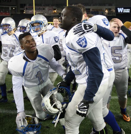 The Oak Park Raiders go nuts after defeating the St Paul Crusaders for the Manitoba High School Football Championship at the Investors Group Field Friday night-See Ed Tait story Nov 07, 2014   (JOE BRYKSA / WINNIPEG FREE PRESS)