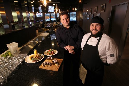 Mike Alfred manager with  St. James Tap and Table with chef Frank McCann in their new pub / restaurant.   Food: Caprese Salad, Grilled Ribeye steak and Braised Beef Bruschetta.  Nov 7,  2014 Ruth Bonneville / Winnipeg Free Press