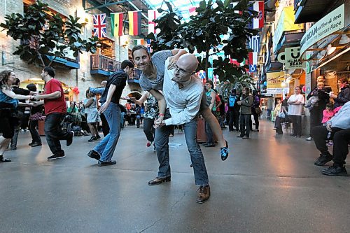 Chris Quehe and Allison Danielsen swing dance together with other dancers in the centre Court of The Forks Saturday afternoon during the Hepcat Dance Studio's five year anniversary celebration which offered a  free dance event for all levels of dancers to take part in.  Standup photo. Nov 8,  2014 Ruth Bonneville / Winnipeg Free Press