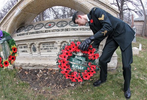 Corporal Kyle Hall of the Royal Winnipeg Rifles handles the wreath at the Regimental Memorial on the grounds of St. John's Cathedral on the 131st birthday of the formation of the 90th ÄúWinnipegÄù Battalion of Rifles.  141109 November 09, 2014 Mike Deal / Winnipeg Free Press