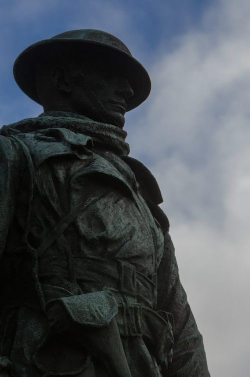 A bronze statue of a First World War soldier stands watch at the corner of Portage Avenue and Main Street. The Bank of Montreal War Monument commemorates the 231 bank employees from across Canada who died in the conflict. It was sculpted by James Earle Farmer and was modeled after Captain Wynn Bagnall, 58th Field Artillery, a member of the banks Winnipeg staff. 141109 - Sunday, November 09, 2014 -  (MIKE DEAL / WINNIPEG FREE PRESS)