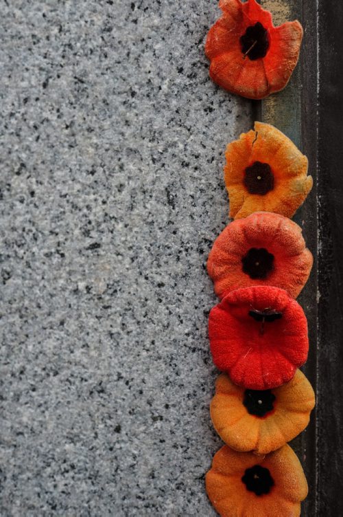 Weathered poppies adorn the war memorial cenotaph column at Memorial Blvd and York Ave. 141109 - Sunday, November 09, 2014 -  (MIKE DEAL / WINNIPEG FREE PRESS)