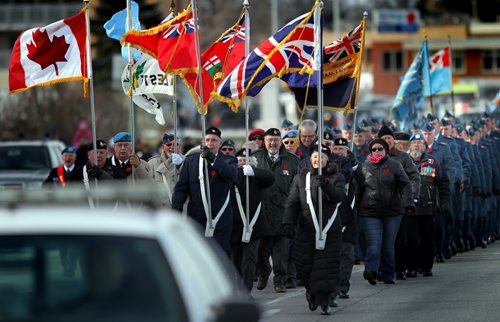 Hundreds gathered (Veterans and citizens) And then lined Portage ave as veterans marched to the St James Legion from the Bruce Park Cenotaph Tuesday morning after the annual Remembrance Day service. See story. November 11, 2014 - (Phil Hossack / Winnipeg Free Press)