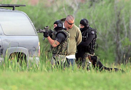BORIS MINKEVICH / WINNIPEG FREE PRESS  070819 Possible armed standoff scene on McGregor Farm Road just north of Bricker Ave. in East St. Paul. RCMP used their SWAT team and robot in the operation. A dog wondered onto the property and was later fetched by it's owner. The owner of the dog was met by SWAT members at gunpoint and then released.